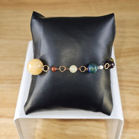 
              Solar System bead bracelet
            